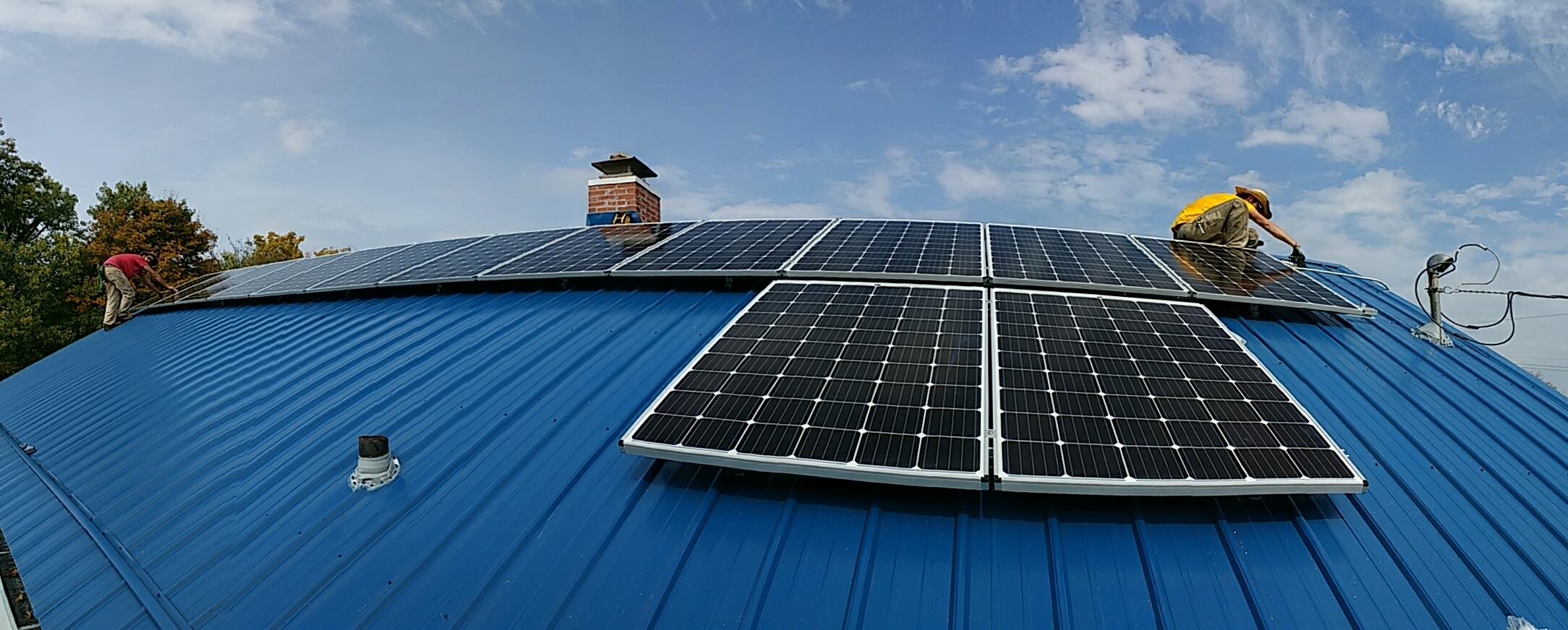 Solar panels being installed on a building's roof